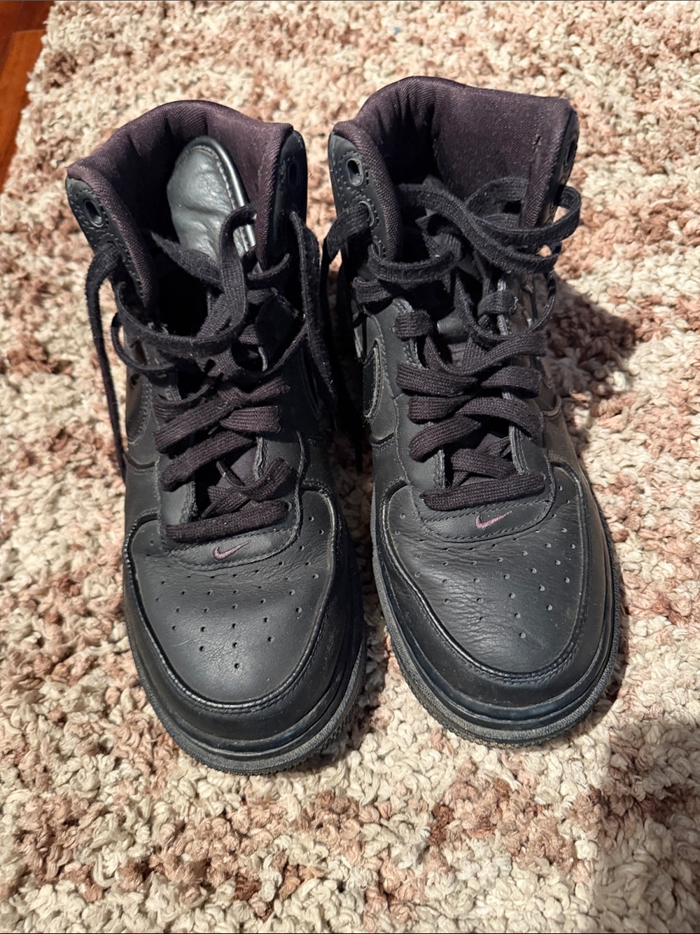 Nike Black High-Top Athletic Sneakers with Small Pink Swoosh